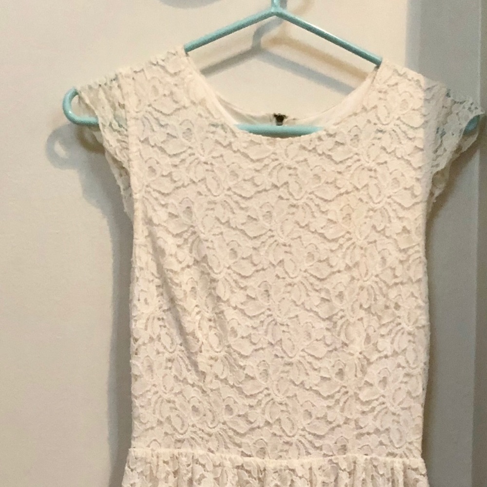 Ivory lace mini dress; hemline falls mid-thigh